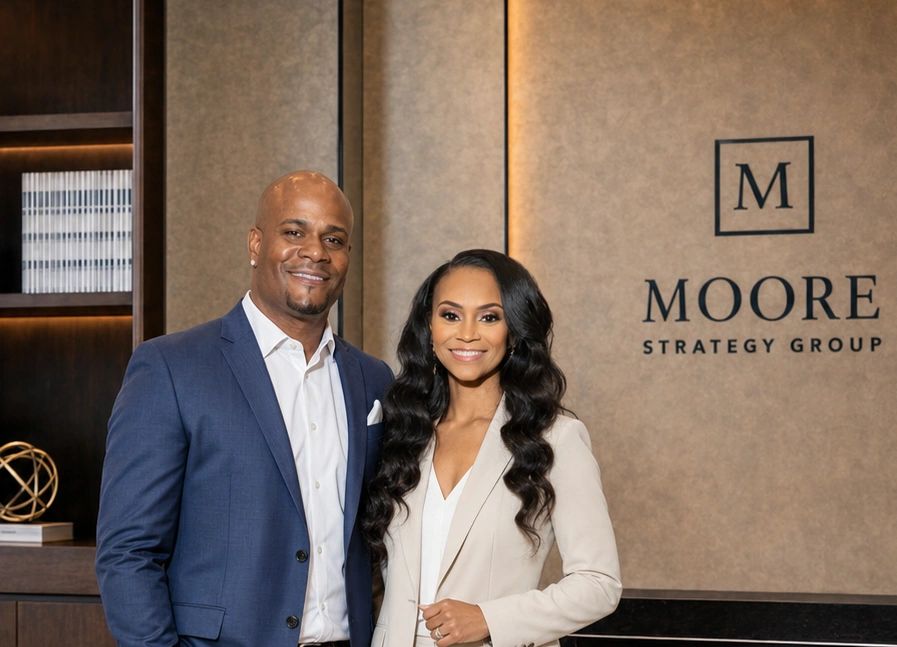 Portrait of David and Jasmine Moore, co-founders of Moore Strategy Group